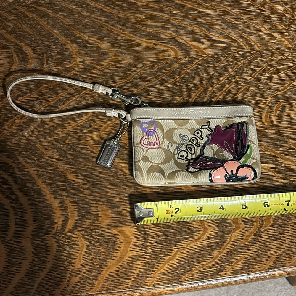 Coach Poppy tiny wristlet.